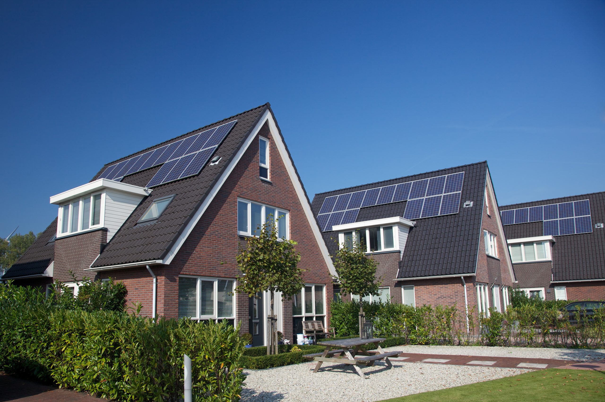 Brick buildings with solar panel systems